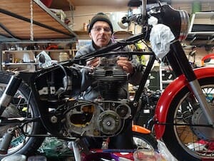 Bob Murdoch working on a Royal Enfield